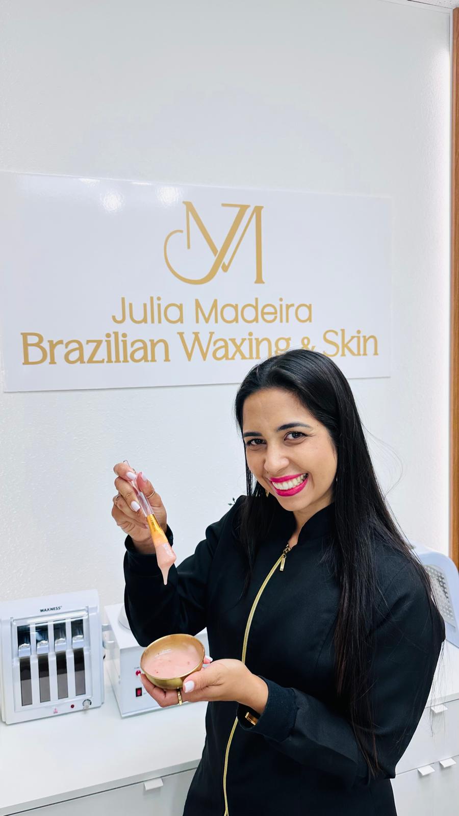 Julia, founder of Julia Madeira Brazilian Waxing & Skin, preparing wax